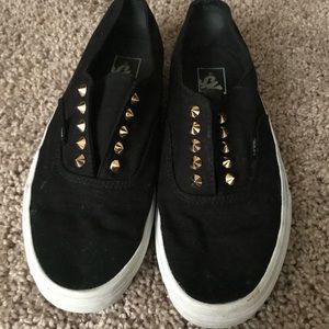 Black / gold spiked cans slip ons